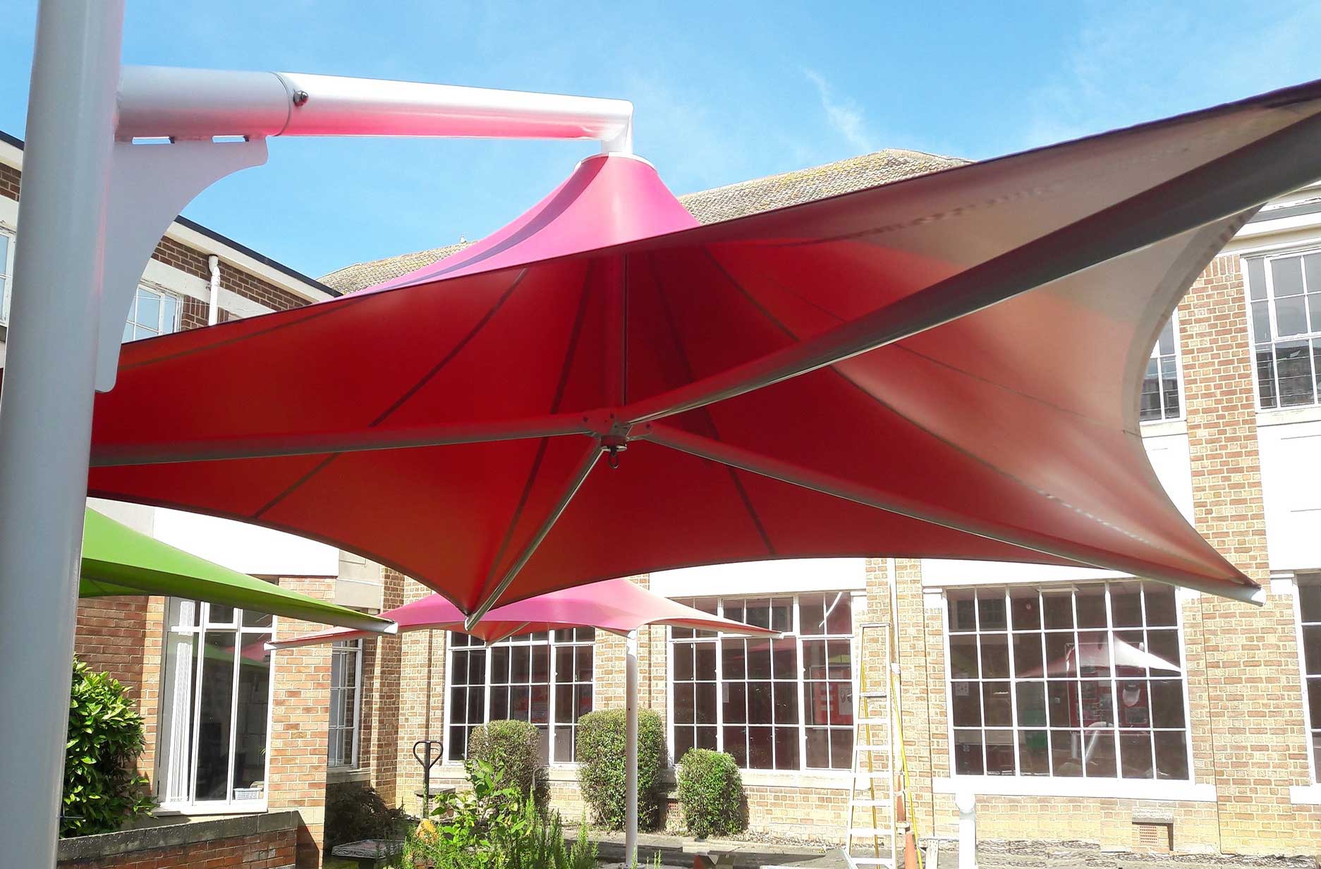 Cyclone extremely strong in wind fixed cantilevered umbrella on a school patio with UV protection