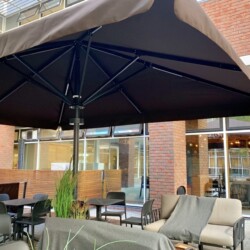 Umbrellas supplied to a hospital shading their cafeteria customers and outdoor seating Hospital Umbrellas for patients and visitors